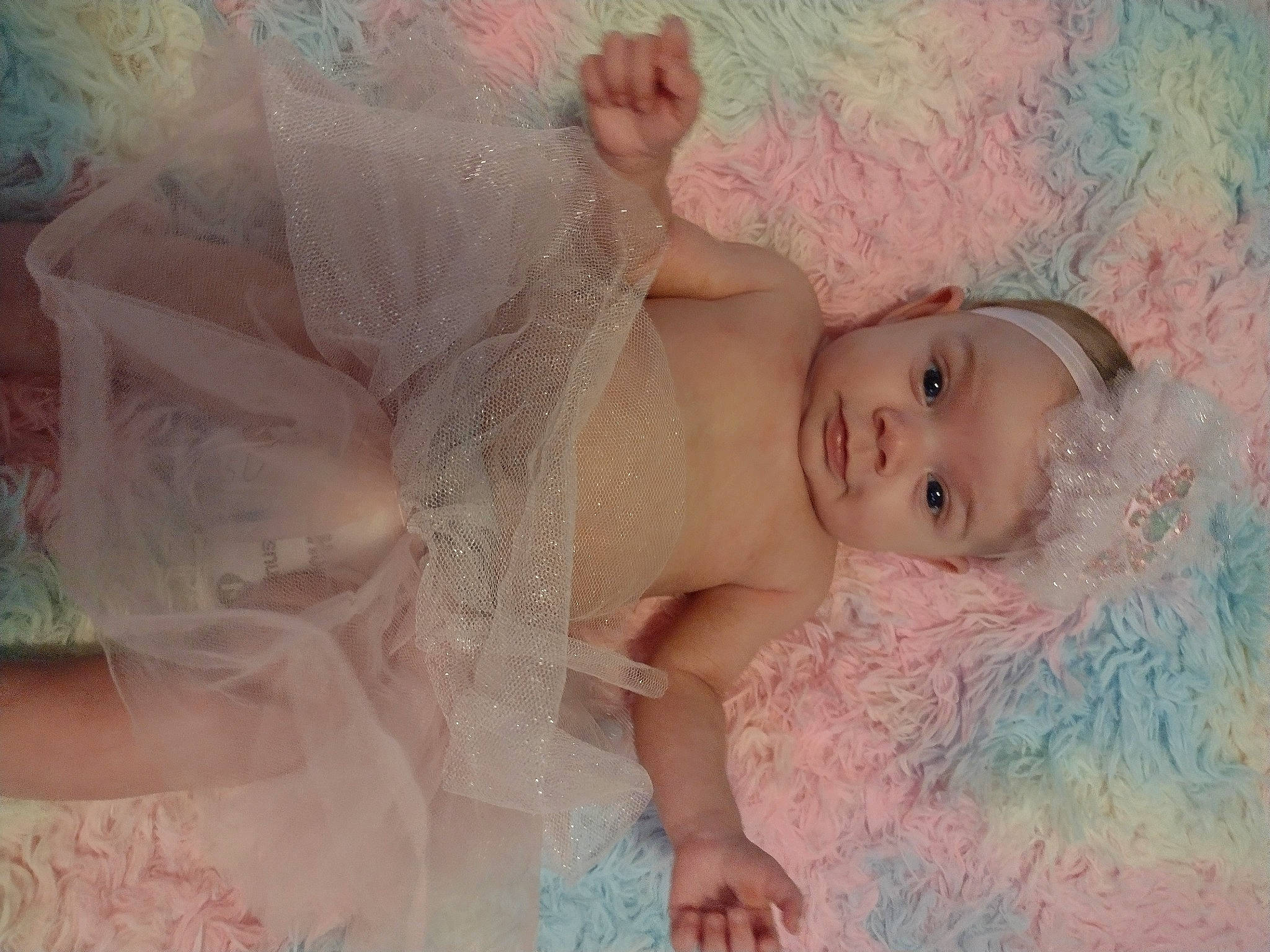 Haisley is registered to the contest to win money with this photo: baby, bathing, cheek, child, embellishment, eyebrow, eyelash, face, facial_expression, fun, hairstyle, happy, headgear, headpiece, iris, lip, person, pink, skin, textile