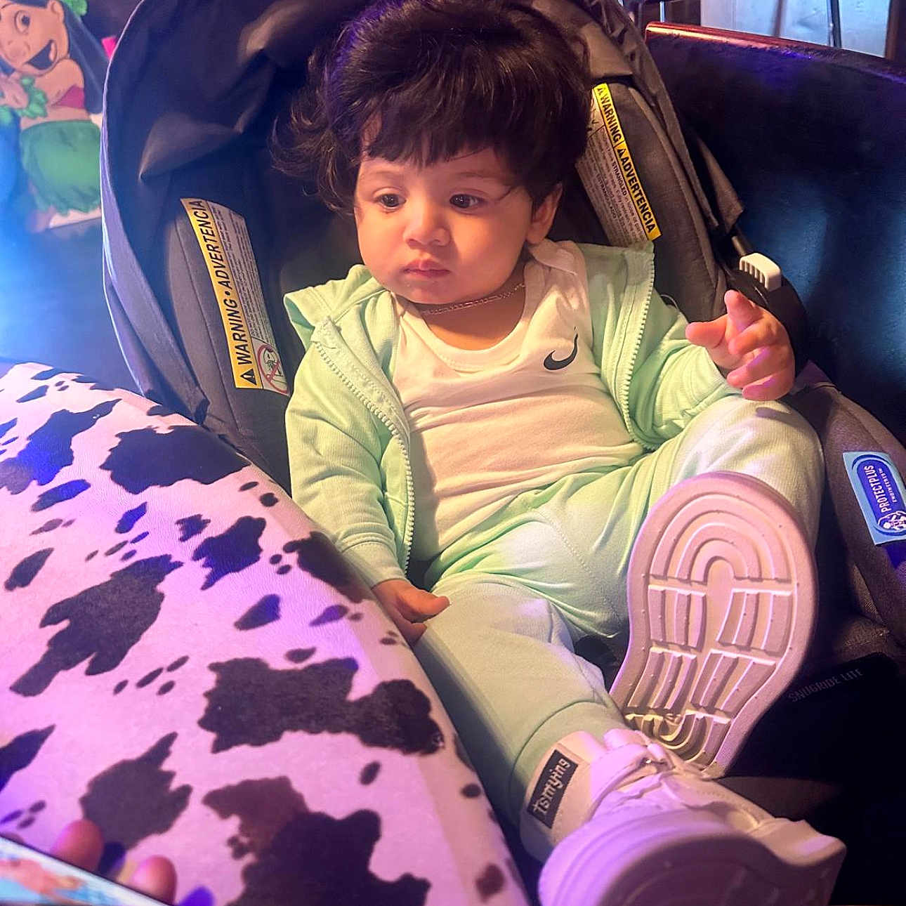 Roiberth joined the competition — help win amazing prizes! baby, car_seat, casual_clothing, child, cow_print, curly_hair, cute, expression, footwear, indoor, indoor_lighting, mint_green, person, portrait, seated, soft_lighting, tablecloth, toddler, white_shoes, young_child