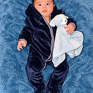 Lucas joined the competition — help win amazing prizes! baby, child, infant, portrait, lying_down, blue_blanket, navy_outfit, hooded_outfit, stuffed_animal, elephant_toy, comforter, wide_eyes, face, hands, indoor, close_up, textile, patterned_background, cute, photography