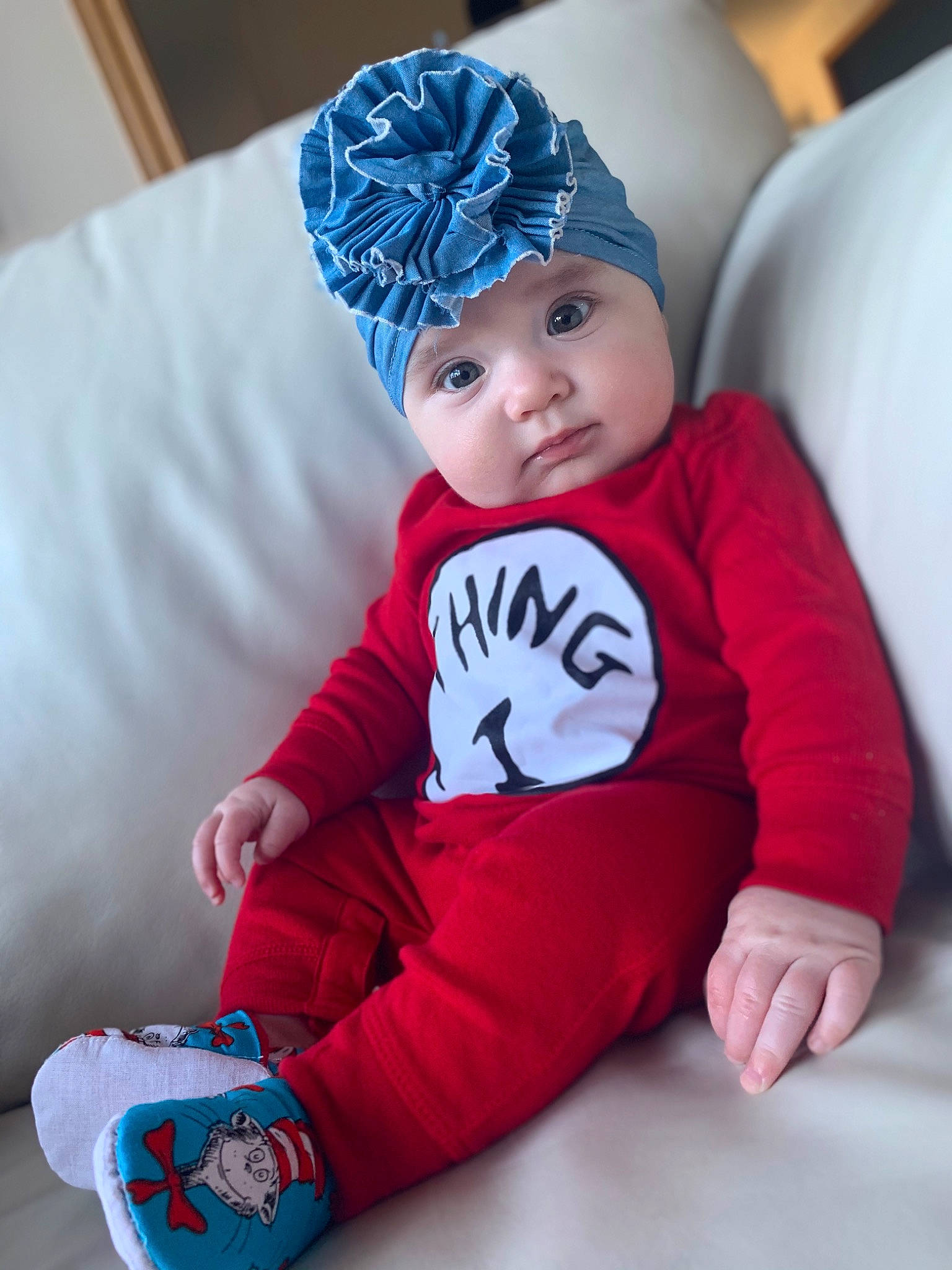 Giovanna joined the competition — help win amazing prizes! baby, baby_toddler_clothing, beanie, blue, cap, child, clothing, fictional_character, headgear, headwear, knit_cap, outerwear, pajamas, person, red, sleeve, t_shirt, toddler