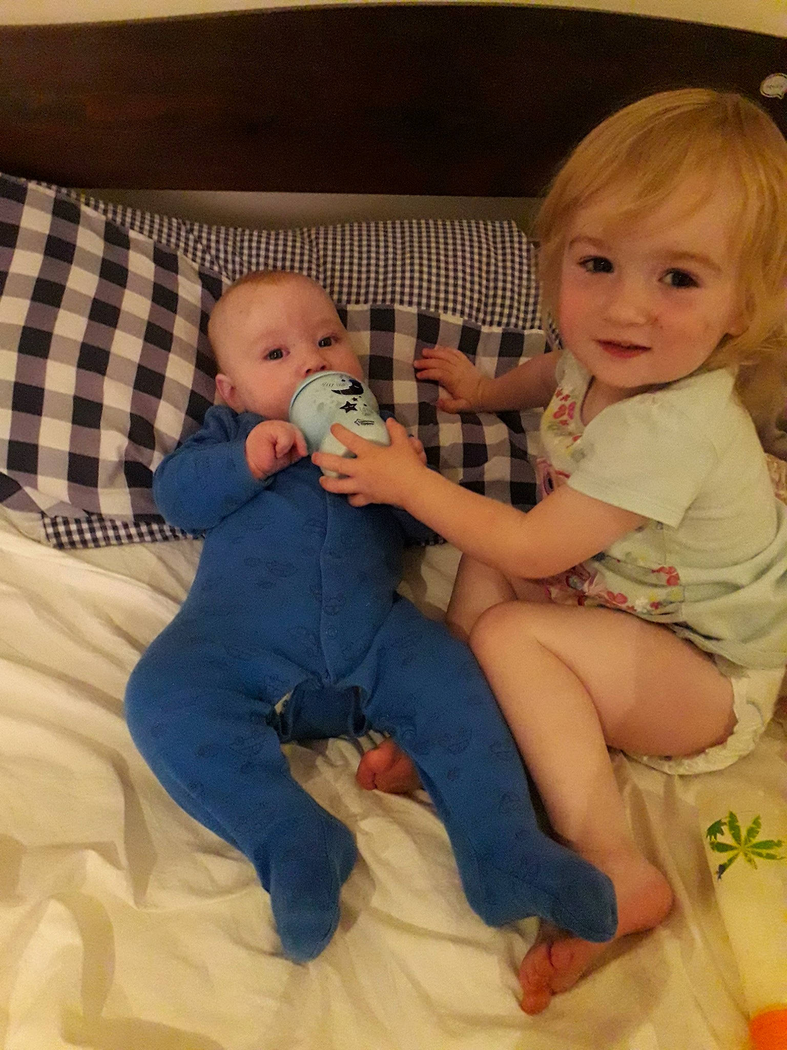 Maisie is registered to the contest to win money with this photo: baby, baby_products, cheek, child, eye, finger, head, iris, leg, mouth, person, product, room, sibling, sitting, skin, thumb, toddler