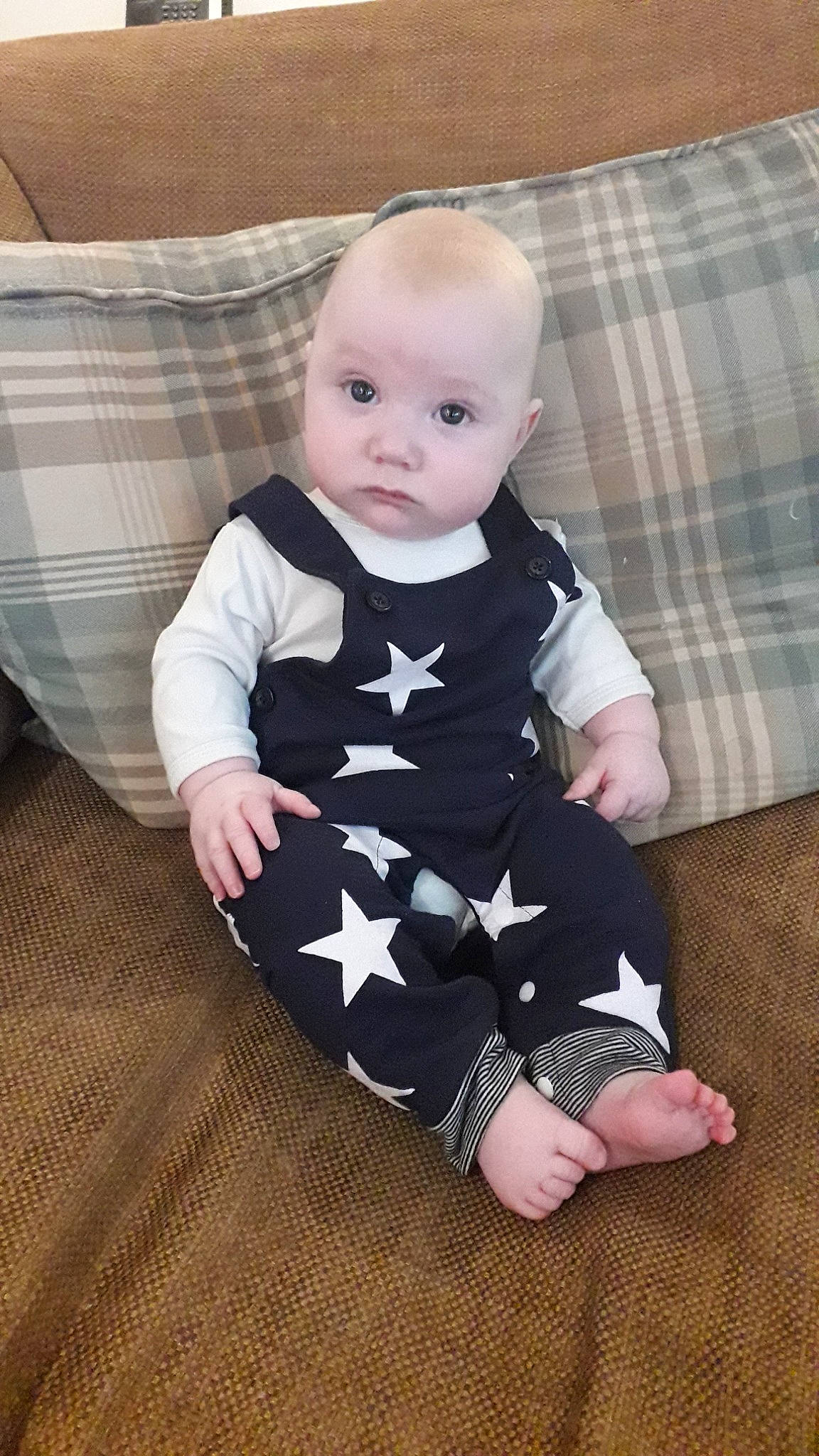 Declan joined the competition — help win amazing prizes! baby, baby_toddler_clothing, cheek, child, floor, flooring, head, leg, pattern, person, product, sitting, skin, sleeve, toddler