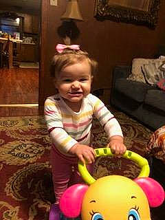 Symphony Wells joined the competition — help win amazing prizes! baby, baby_playing_with_toys, baby_products, baby_toys, child, event, flooring, fun, happy, holiday, joy, party_supply, person, picture_frame, play, riding_toy, room, sitting, smile, toddler