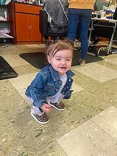 Symphony Wells joined the competition — help win amazing prizes! asphalt, cabinetry, chair, child, clothing, drawer, floor, flooring, fun, hardwood, joint, joy, leg, person, road_surface, shoe, sidewalk, sitting, smile, sneakers