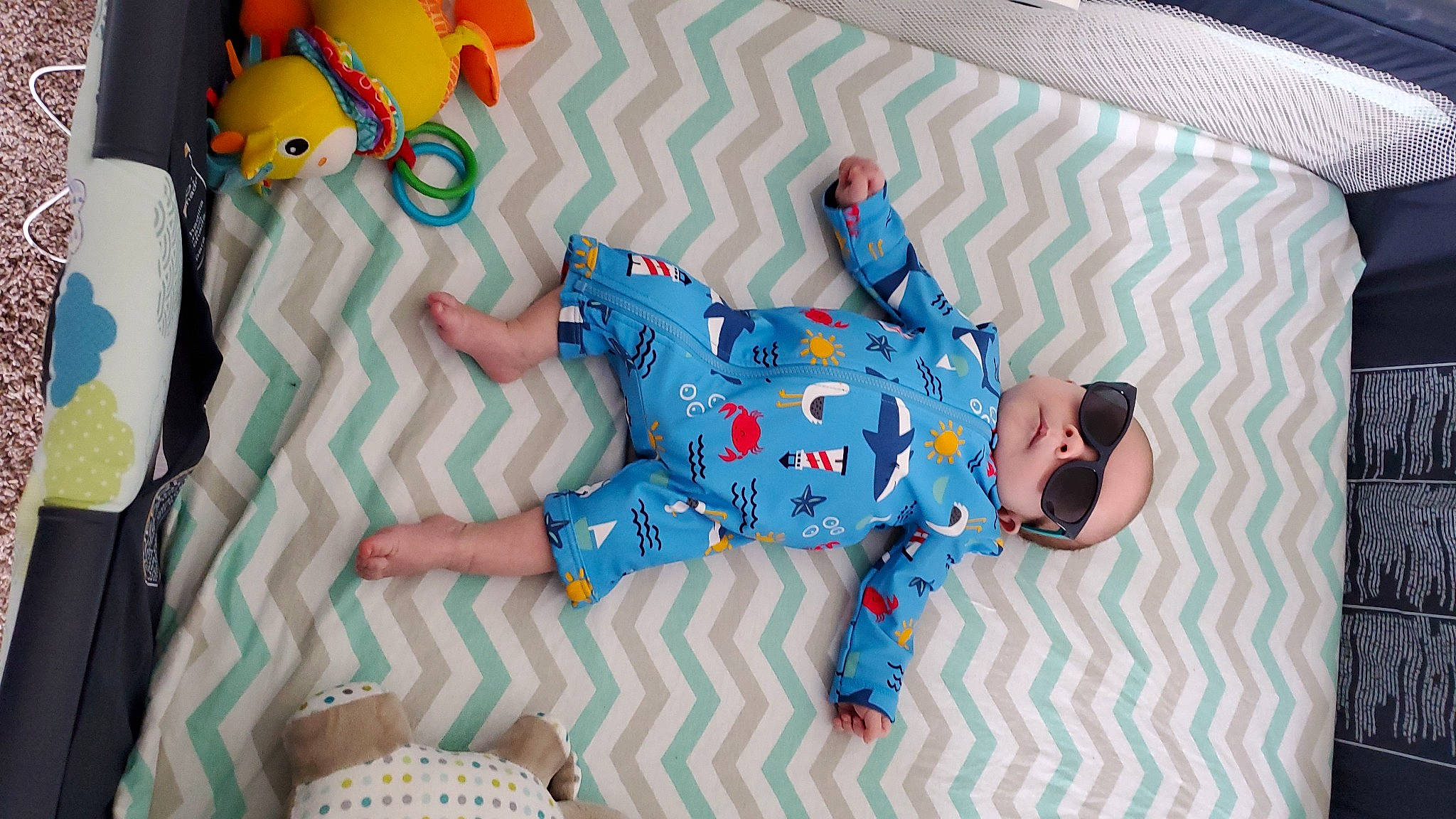 Lyam joined the competition — help win amazing prizes! baby_toys, bed_sheet, blue, games, headwear, linens, person, product, textile, toy, turquoise, world