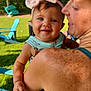 baby, child, woman, outdoor, greenery, trees, blue_eyes, pink_bow, freckles, shoulder, smile, happy, sunlight, grass, chair, summer, casual_clothing, headband, portrait, family