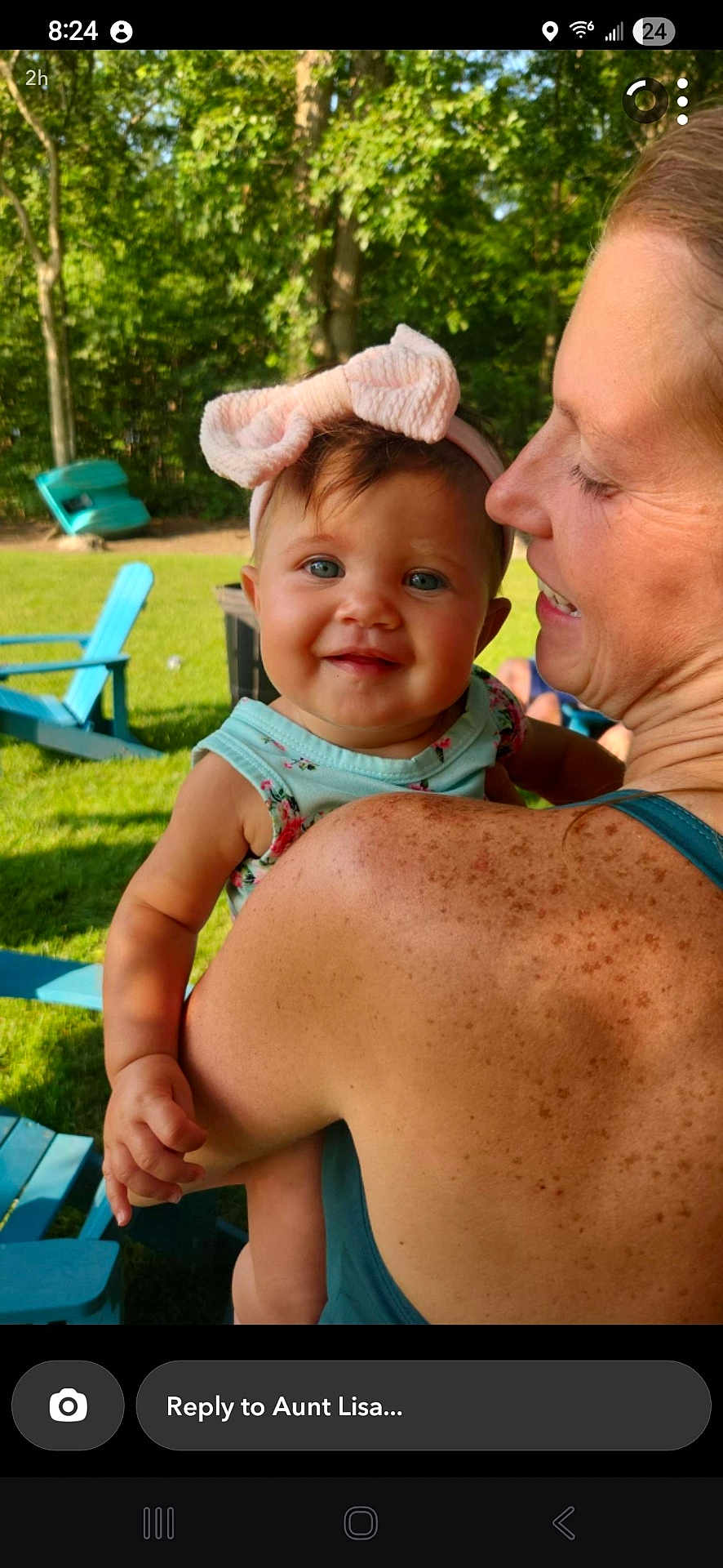 Loretta joined the competition — help win amazing prizes! baby, child, woman, outdoor, greenery, trees, blue_eyes, pink_bow, freckles, shoulder, smile, happy, sunlight, grass, chair, summer, casual_clothing, headband, portrait, family