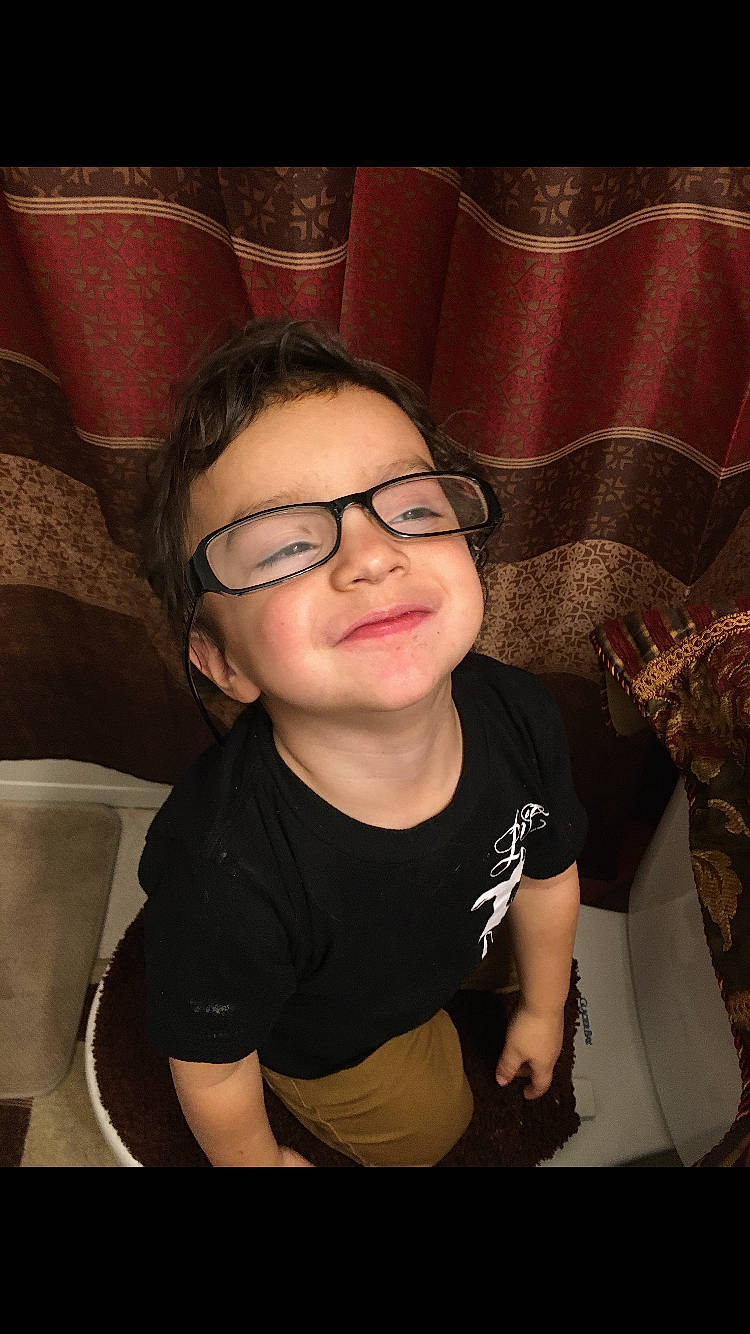 Eric Carmello joined the competition — help win amazing prizes! cheek, child, comfort, elbow, eyebrow, eyewear, flash_photography, fun, glasses, happy, jaw, joy, lip, person, room, sitting, sleeve, smile, t_shirt, thigh