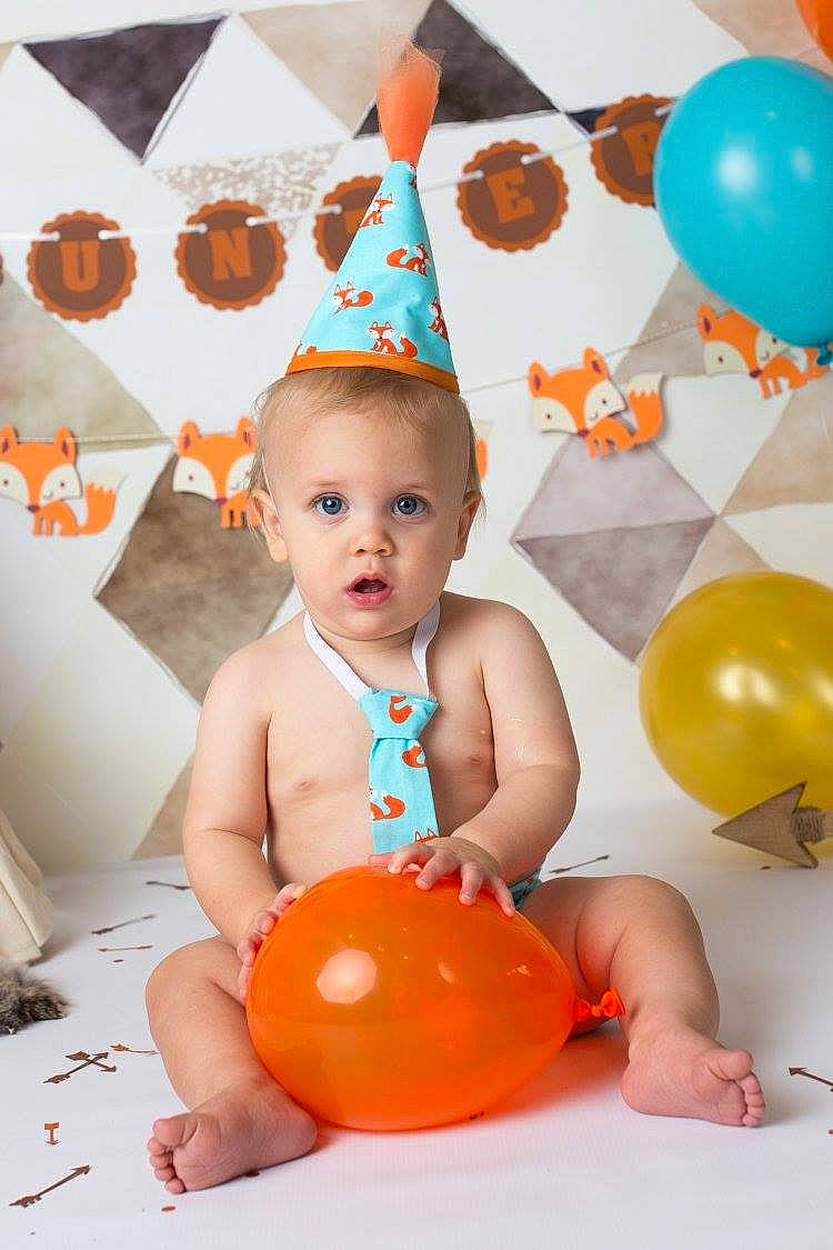 Hunter Baker is registered to the contest to win money with this photo: birthday, child, fun, infant, orange, party_hat, person, play, smile, toddler, toy