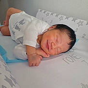Axel participe au concours pour gagner de l'argent avec cette photo : newborn, baby, sleeping, infant, white_onesie, bunny_prints, mattress, star_pattern, soft_surface, peaceful, smile, face, hand, cute, indoors, child, portrait, resting, tiny, cozy