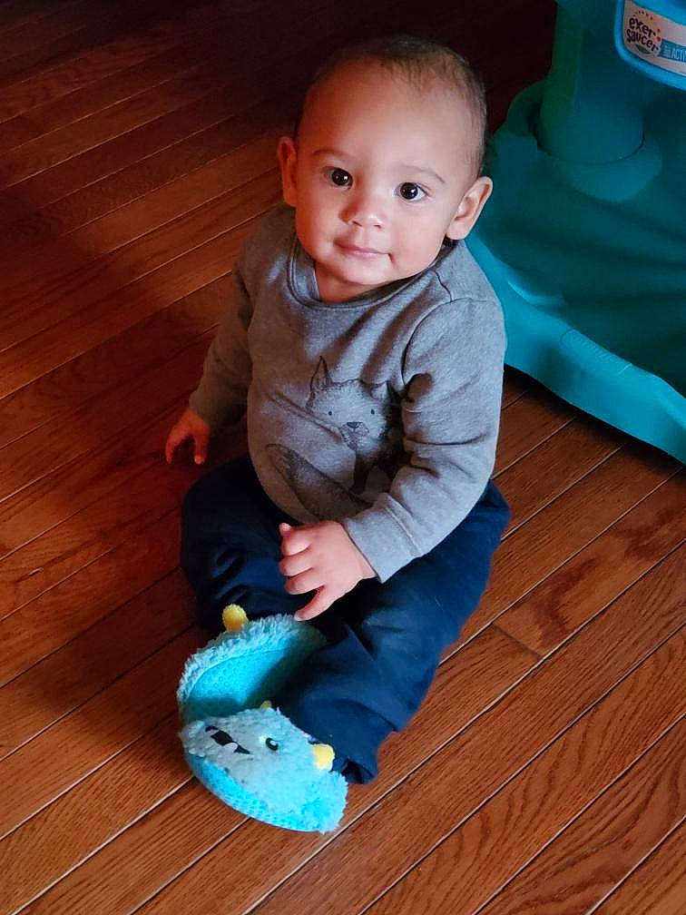 Larry joined the competition — help win amazing prizes! baby, baby_toddler_clothing, child, floor, flooring, person, play, sitting, skin, smile, standing, toddler, turquoise, wood