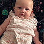 baby, infant, romper, floral_pattern, bunny_print, blanket, galaxy_pattern, blue_eyes, skin, face, chubby_cheeks, arm, hand, soft_light, indoor, portrait, clothing, comfort, lying_down, cute
