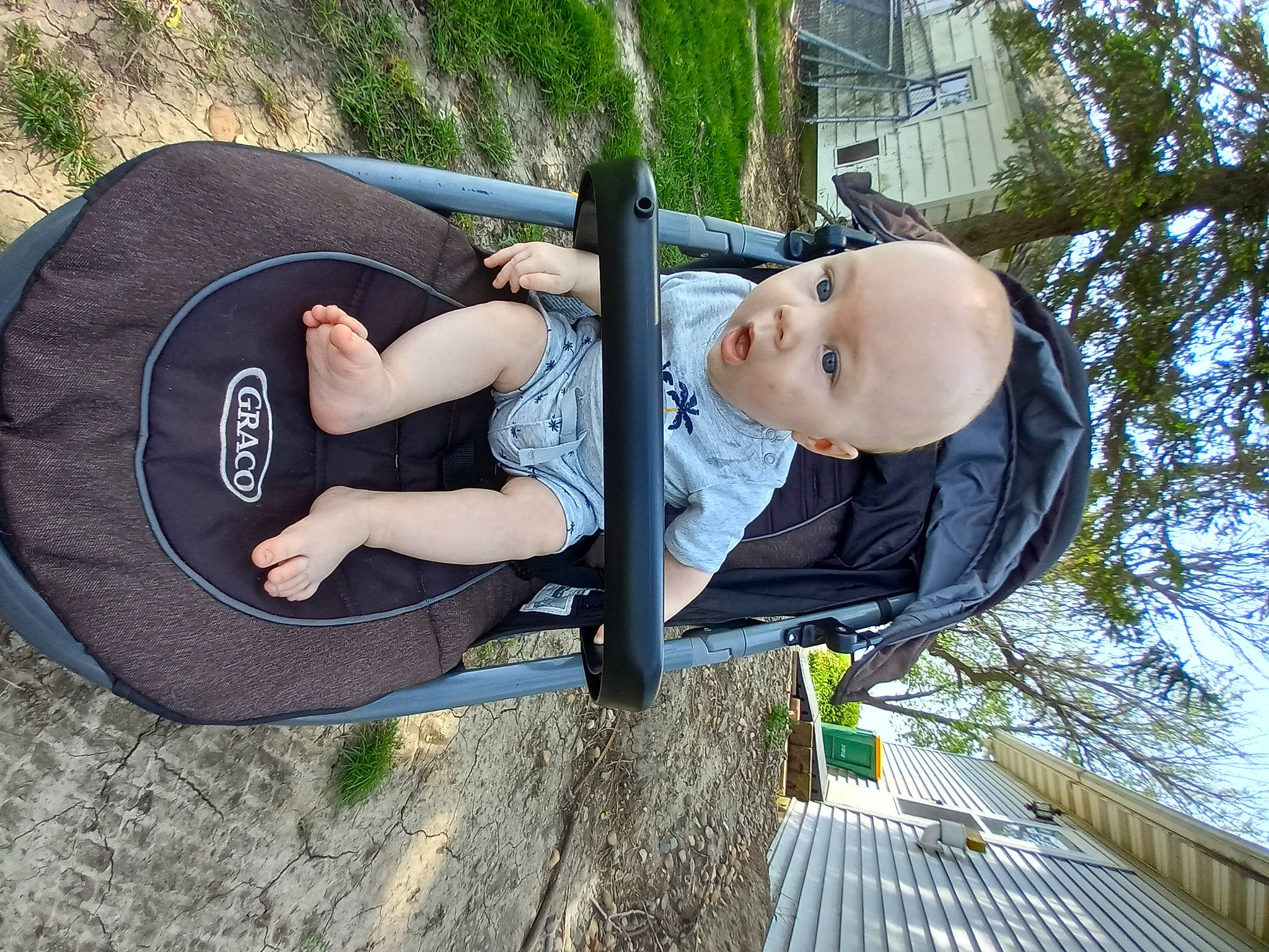 Jeremiah joined the competition — help win amazing prizes! automotive_tire, baby, baby_products, chair, comfort, fun, grass, hat, human_leg, leisure, person, plant, recreation, sitting, sky, smile, sun_hat, surprise, thigh, tire