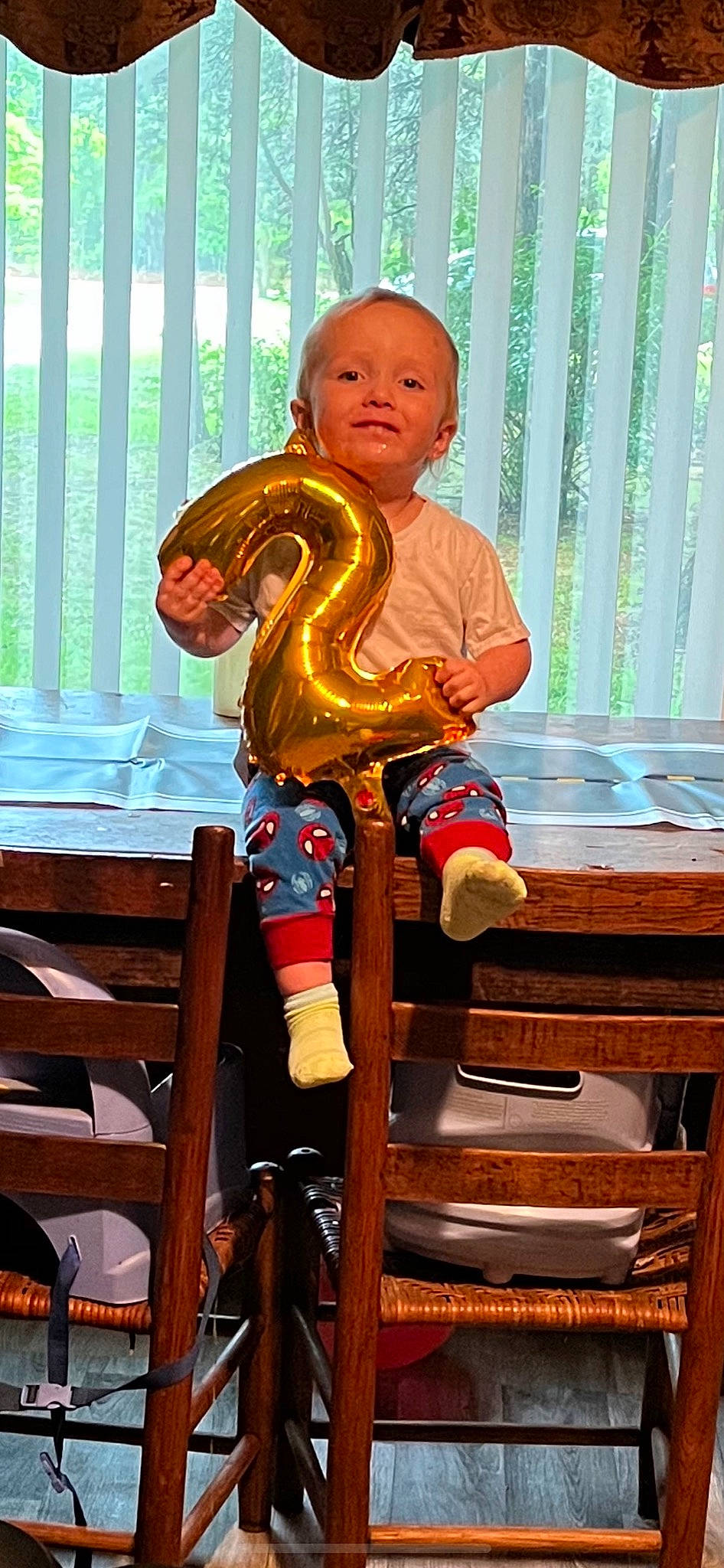 Kaine joined the competition — help win amazing prizes! baby_toddler_clothing, chair, child, fun, human_leg, leg, leisure, organ, person, product, recreation, reptile, room, scaled_reptile, serpent, shorts, sitting, snake, t_shirt, toddler
