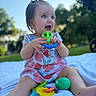 baby, child, toy, outdoor, grass, blanket, smile, happy, playing, nature, sunlight, cute, person, summer, garden, blue_sky, greenery, sitting, clothing, fun