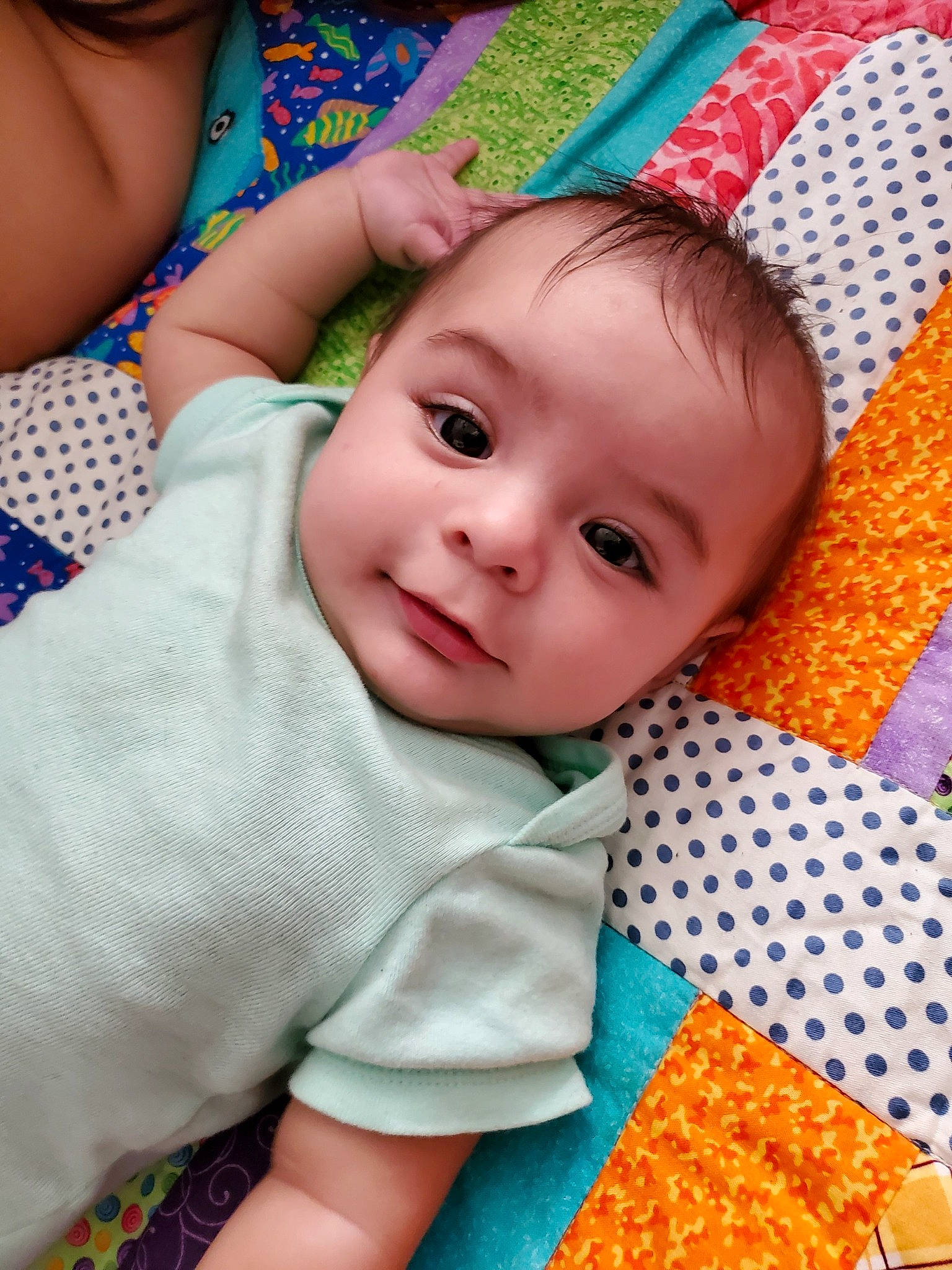 Noland is registered to the contest to win money with this photo: baby, baby_toddler_clothing, blue, cheek, eye, face, facial_expression, green, happy, head, iris, lip, nose, organ, person, photograph, pink, skin, sleeve, textile