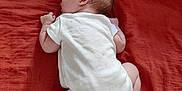 Isaé participe au concours pour gagner de l'argent avec cette photo : baby, infant, sleeping, white_onesie, bed, bedding, pillow, soft_toy, banana_toy, curled_up, peaceful, skin, hair, resting, indoors, child, newborn, cute, toddler, sleep