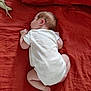 baby, infant, sleeping, white_onesie, bed, bedding, pillow, soft_toy, banana_toy, curled_up, peaceful, skin, hair, resting, indoors, child, newborn, cute, toddler, sleep