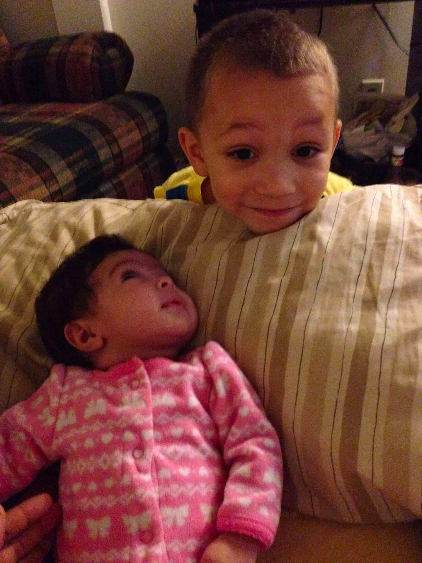 Halen is registered to the contest to win money with this photo: bedtime, child, family, human_positions, infant, joy, people, person, skin, toddler