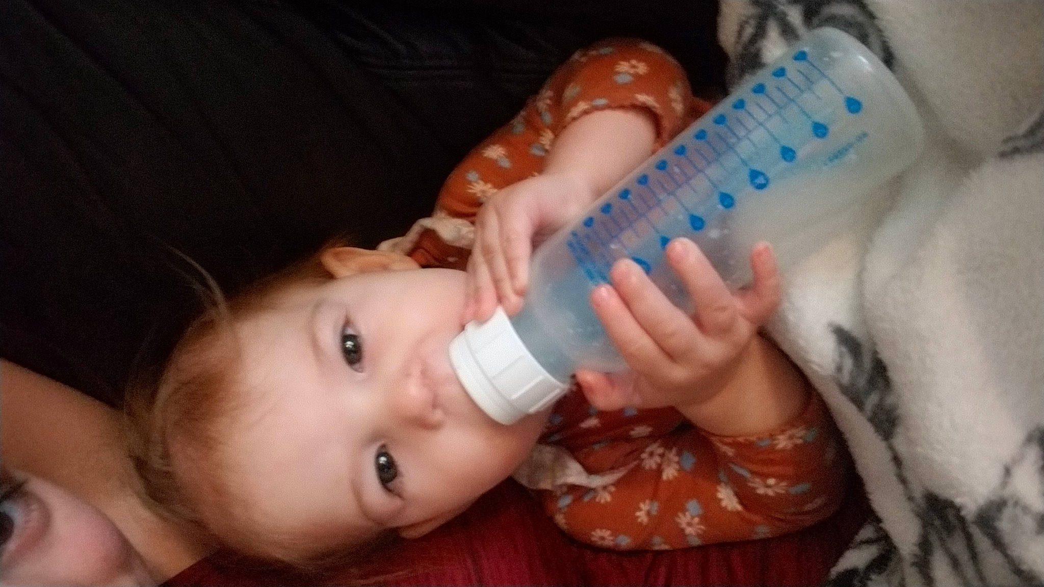 Leila joined the competition — help win amazing prizes! baby, baby_bottle, baby_toddler_clothing, bottle, cheek, child, drink, drinkware, ear, eyelash, finger, fluid, gesture, iris, mouth, nail, nose, person, plastic_bottle, skin