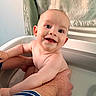 James participe au concours pour gagner de l'argent avec cette photo : baby, child, smiling, bath, water, towel, hand, skin, happy, cute, infant, person, portrait, indoor, parent, holding, clean, young, bathroom, naked