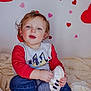 child, toddler, baby, heart, hearts, valentine, portrait, sitting, shoe, sneaker, jeans, sweater, red_sleeves, blanket, cozy, cute, indoor, portrait_photography, face, smile