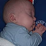 Nolhan participe au concours pour gagner de l'argent avec cette photo : baby, blanket, blue_clothing, cheeks, closeup, cushion, ear, face, hands, head, infant, logo, newborn, nighttime, pajamas, peaceful, portrait, side_profile, sleeping, soft_texture