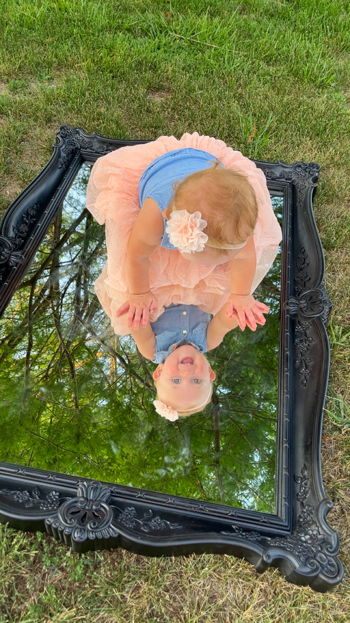 Claire is registered to the contest to win money with this photo: art, automotive_exterior, automotive_tire, baby, baby_products, bicycle_tire, dress, grass, joy, leisure, metal, motor_vehicle, person, picture_frame, plant, rim, tire, toddler, tree, vehicle_door