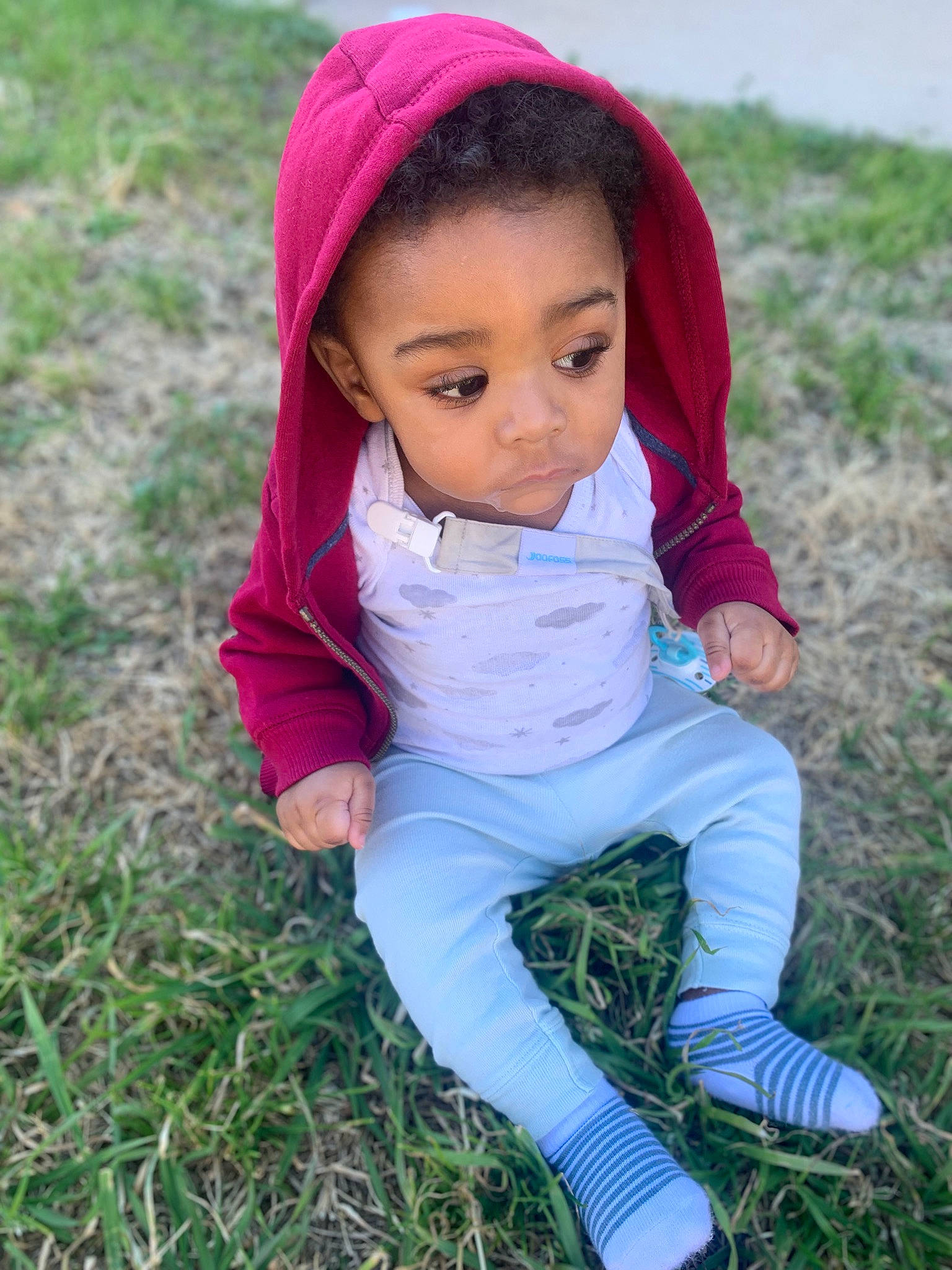 Ace joined the competition — help win amazing prizes! baby, child, eye, face, facial_expression, fun, grass, grassland, hand, happy, head, leaf, lip, natural_environment, people_in_nature, person, pink, plant, sitting, skin