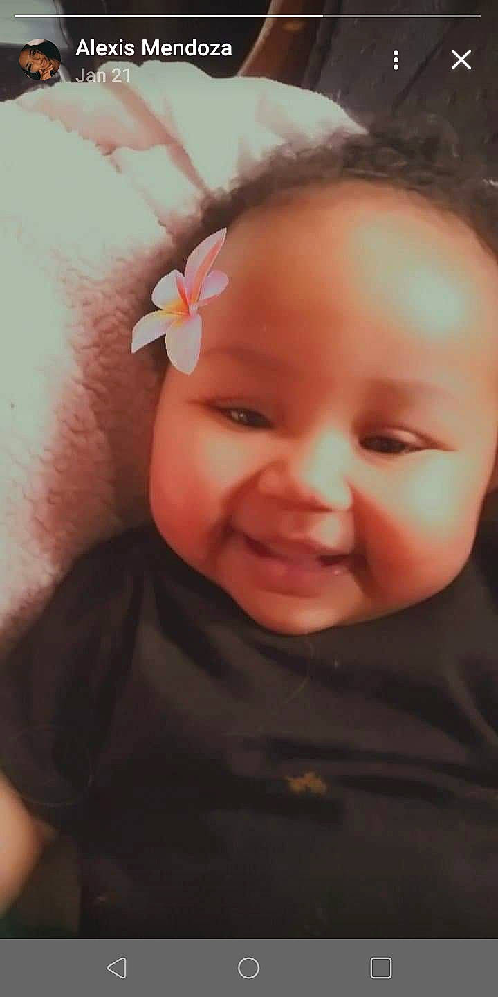 Aile is registered to the contest to win money with this photo: baby, beauty, cheek, child, chin, close_up, ear, eye, eyebrow, face, facial_expression, forehead, hair_accessory, head, joy, lip, mouth, nose, person, pink