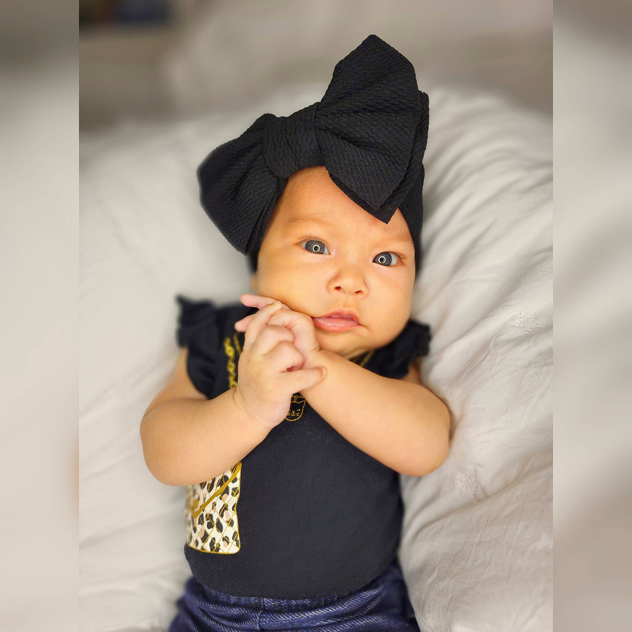 Camila joined the competition — help win amazing prizes! arm, baby, baby_toddler_clothing, black_hair, cap, cheek, child, elbow, eye, fashion_accessory, flash_photography, gesture, happy, headgear, headwear, lip, nose, person, sitting, sleeve