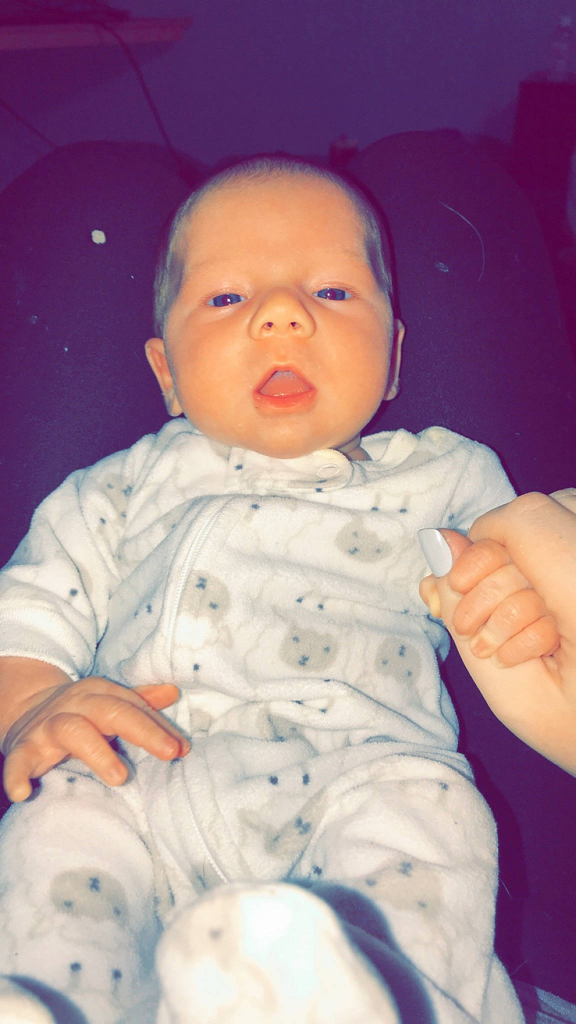 Carson is registered to the contest to win money with this photo: baby, cheek, child, chin, eye, face, facial_expression, finger, fun, hand, head, lip, mouth, nose, person, pink, portrait, sitting, skin, smile