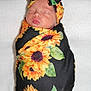 Lelanie joined the competition — help win amazing prizes! newborn, baby, sleeping, swaddle, headband, bow, sunflower, flower_pattern, blanket, cute, infant, wrapped, peaceful, portrait, soft, cozy, child, resting, closed_eyes, adorable