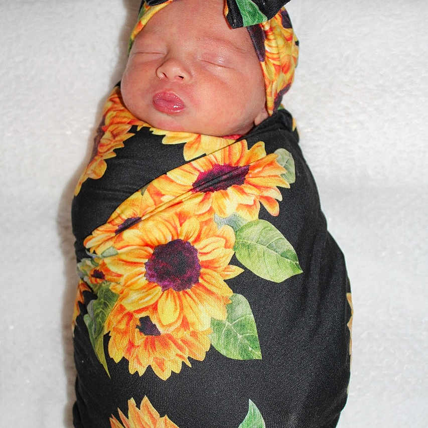 Lelanie joined the competition — help win amazing prizes! adorable, baby, blanket, bow, child, closed_eyes, cozy, cute, flower_pattern, headband, infant, newborn, peaceful, portrait, resting, sleeping, soft, sunflower, swaddle, wrapped