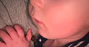 Truett joined the competition — help win amazing prizes! baby, casual_clothing, child, closeup, cozy, cuddling, eyelashes, face, hand, human, indoor, infant, peaceful, portrait, resting, skin, sleeping, soft_light, striped_clothing, toddler