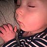Truett joined the competition — help win amazing prizes! baby, sleeping, child, striped_clothing, hand, face, infant, closeup, portrait, soft_light, peaceful, resting, cuddling, toddler, skin, eyelashes, cozy, casual_clothing, indoor, human