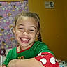Elizabethfaye joined the competition — help win amazing prizes! blanket, child, childhood, colorful_background, cute, face, fun, green_clothing, happy, holding, indoor, lollipop, pajamas, person, playful, polka_dots, portrait, red_clothing, smiling, young