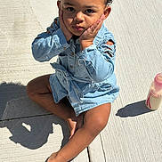 Keemaya joined the competition — help win amazing prizes! toddler, child, denim, blue_jacket, curly_hair, sidewalk, concrete, shadow, barefoot, baby_bottle, sunlight, outdoor, cute, sitting, hands_on_face, pensive, casual_clothing, young_child, portrait, daylight
