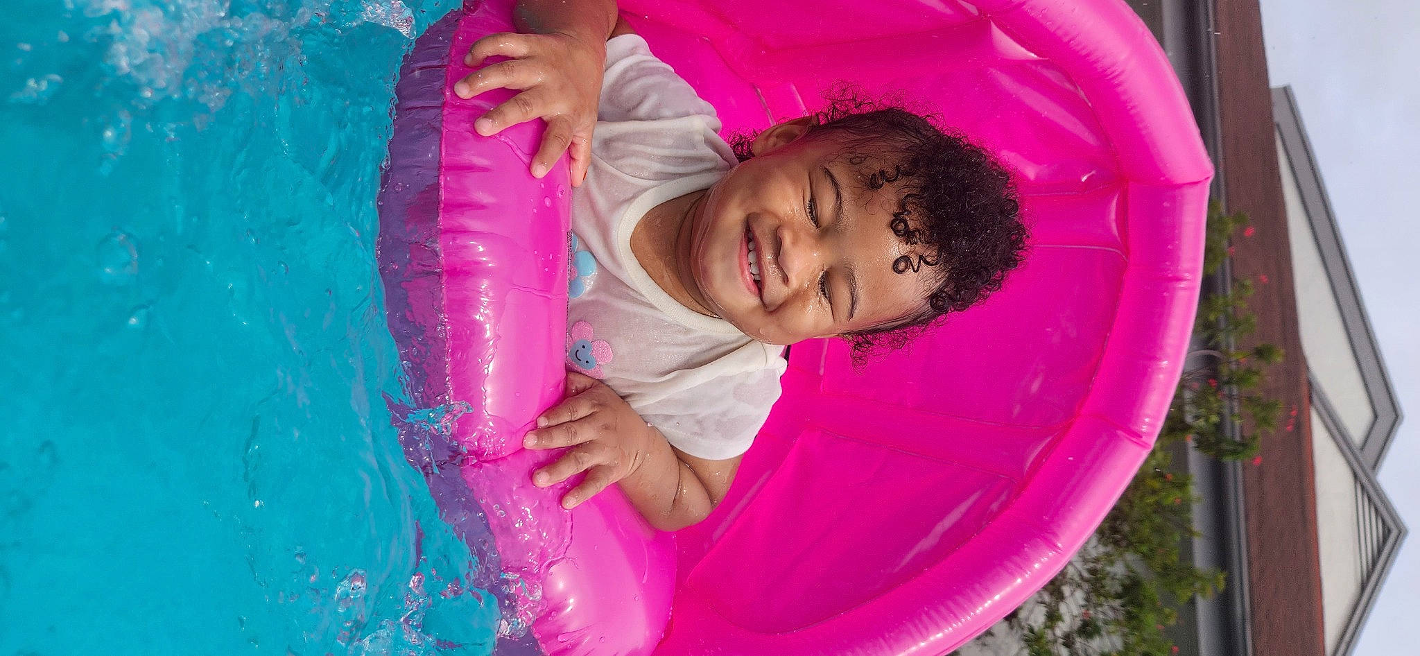 Aadiya is registered to the contest to win money with this photo: baby, baby_toddler_clothing, bathing, child, circle, fun, happy, joy, leisure, magenta, organ, person, pink, play, product, purple, recreation, red, smile, swimming_pool