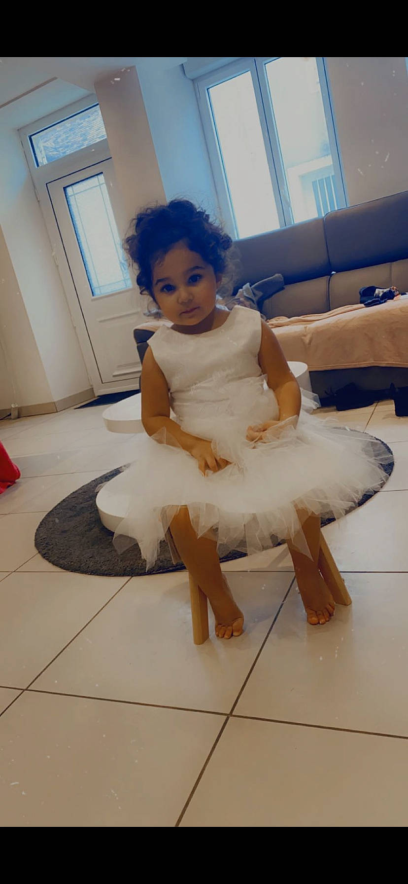 Aliyah participe au concours pour gagner de l'argent avec cette photo : ankle, ballet_shoe, ballet_tutu, clothing, cone, couch, dance, day_dress, dress, embellishment, floor, flooring, foot, fur, living_room, one_piece_garment, person, ruffle, studio_couch, tile