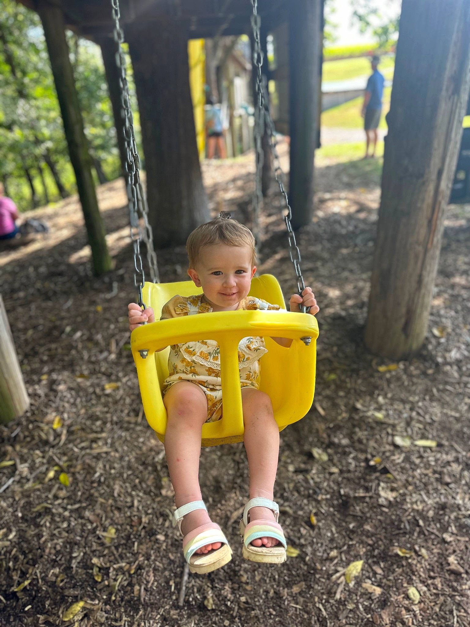 Azalea is registered to the contest to win money with this photo: baby, baby_toddler_clothing, child, city, fun, grass, happy, joy, leaf, leisure, outdoor_play_equipment, people_in_nature, person, plant, playground, recreation, shorts, smile, swing, toddler