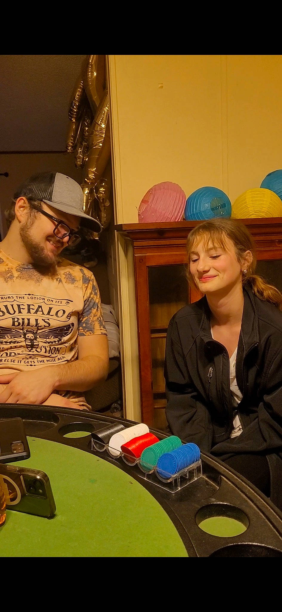 Kyli is registered to the contest to win money with this photo: art, baseball_cap, beard, cap, chair, conversation, design, event, eyewear, fedora, fun, hat, headwear, job, joy, necklace, person, recreation, room, sitting