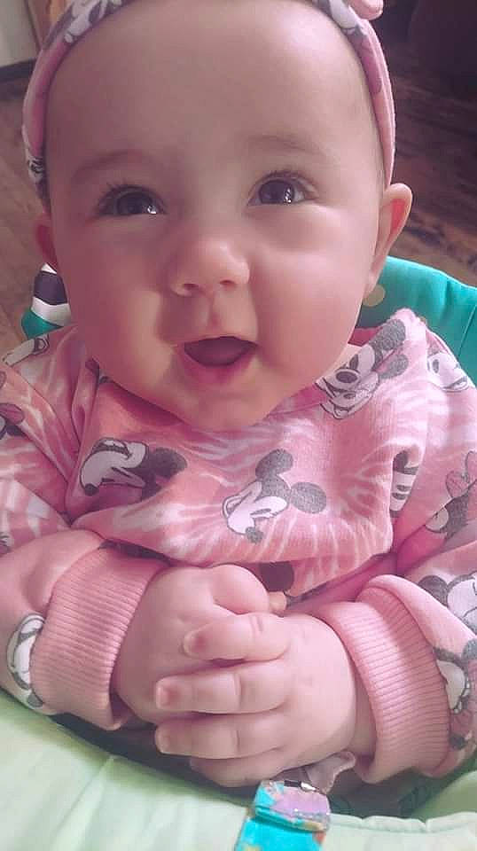 Kaydee is registered to the contest to win money with this photo: baby, baby_toddler_clothing, cheek, chin, comfort, gesture, hair, hairstyle, human_body, iris, lip, mouth, nose, person, photograph, pink, product, skin, sleeve, smile