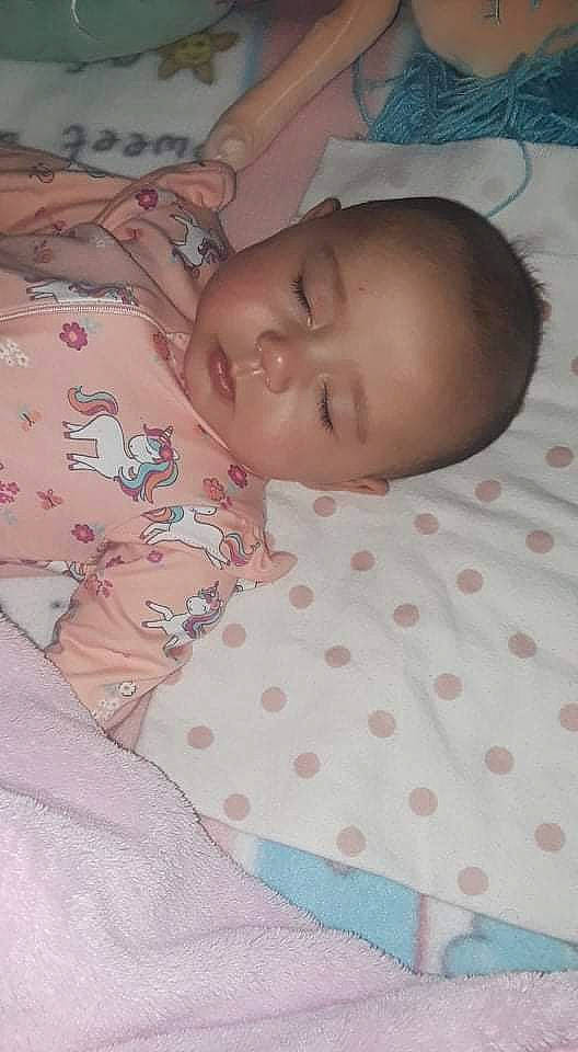 Kaydee is registered to the contest to win money with this photo: baby, baby_products, baby_safety, baby_sleeping, baby_toddler_clothing, bed, bed_sheet, bedding, bedtime, cheek, child, comfort, linens, pattern, person, room, skin, sleeve, textile, thumb