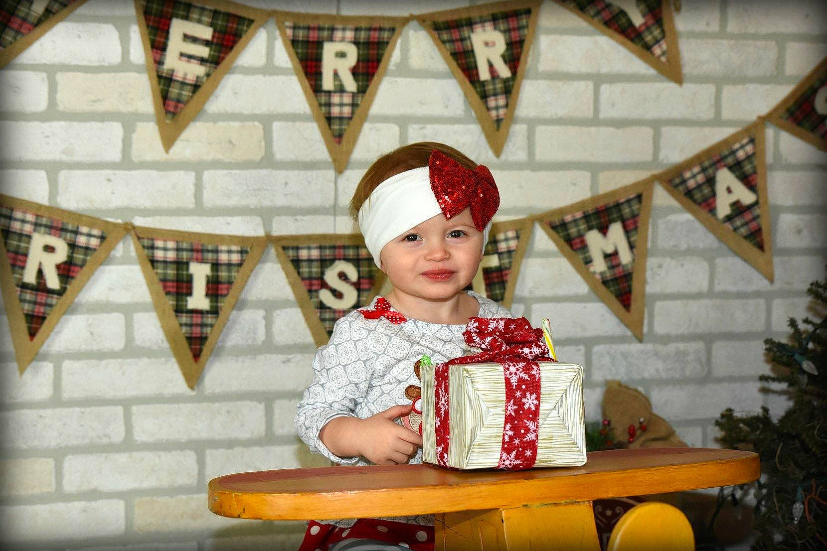 Allyssa is registered to the contest to win money with this photo: child, christmas, christmas_decoration, event, girl, holiday, person, tradition