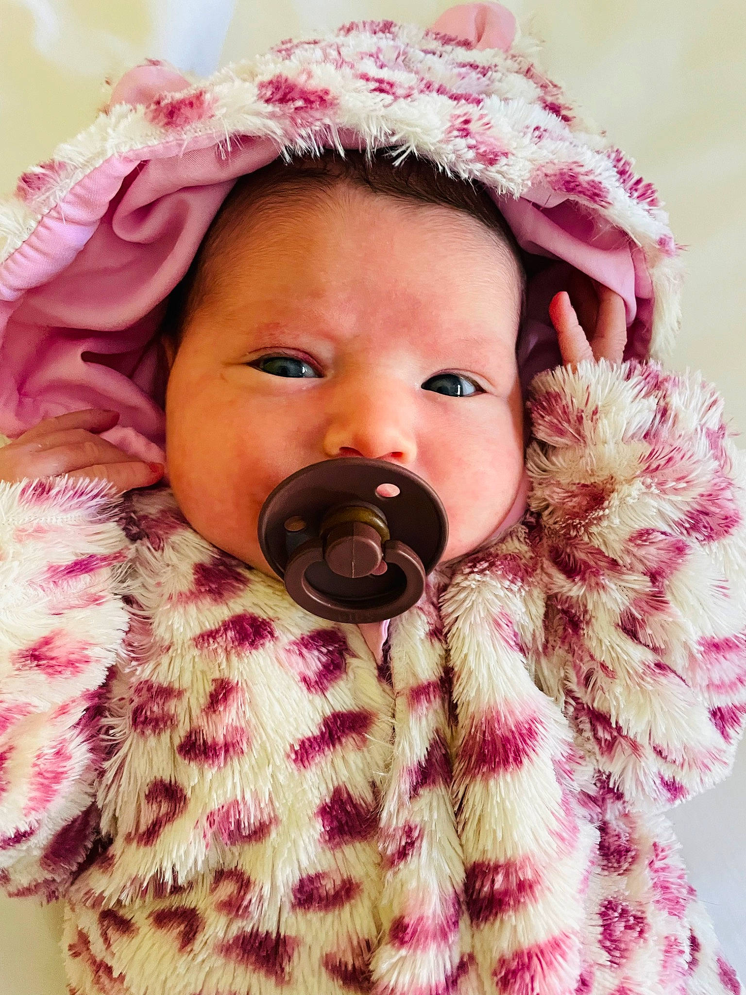 Skylar is registered to the contest to win money with this photo: baby, baby_toddler_clothing, cheek, eye, eyelash, face, facial_expression, happy, headgear, jacket, lip, magenta, nose, outerwear, person, pink, skin, sleeve, textile, toddler