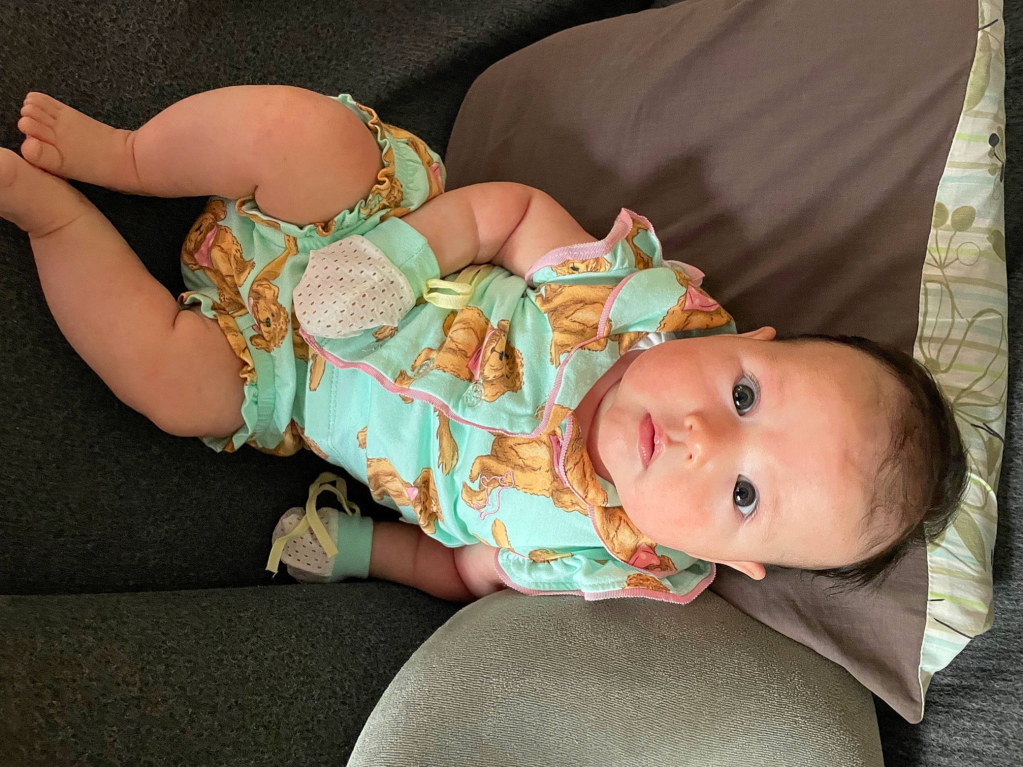 Skylar is registered to the contest to win money with this photo: baby, baby_products, baby_toddler_clothing, cheek, chest, child, comfort, fashion_accessory, finger, headgear, human_body, human_leg, nail, pattern, person, sitting, skin, sleeve, thigh, toddler