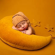 Roman joined the competition — help win amazing prizes! baby, sleeping, hat, pillow, yellow, mustard, star, knit, cozy, soft, newborn, resting, child, cute, portrait, indoor, warm_colors, peaceful, background, blanket