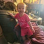Aaliyah joined the competition — help win amazing prizes! blanket, cat, child, clutter, couch, cozy, curious_cat, furniture, happy, home, indoors, jar, lamp, person, pink_clothing, portrait, shelf, smiling, table, toddler