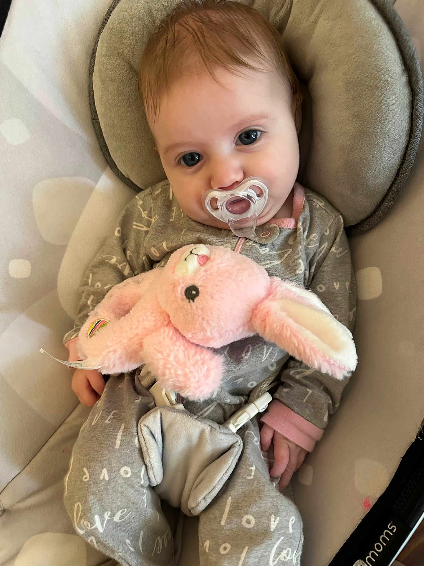 Ellipsis joined the competition — help win amazing prizes! baby, infant, pacifier, plush_bunny, onesie, bouncer_seat, safety_buckle, blue_eyes, cute, soft_toy, portrait, indoor, cozy, hand, hair, fabric_pattern, closeup, sleepy, nursery_item, adorable